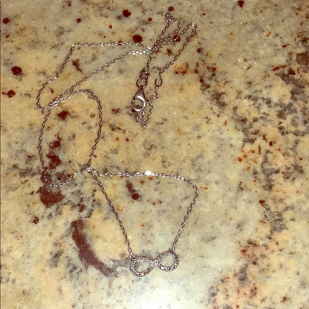 Silver and diamond infinity necklace